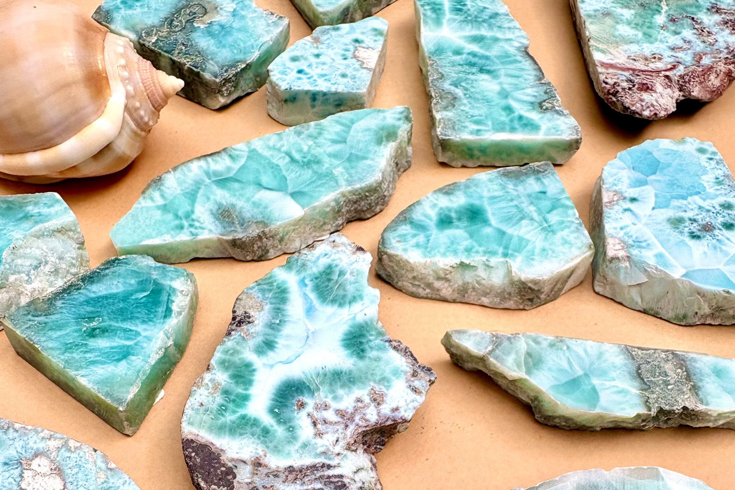 Natural Larimar specimens, polished slabs and blue Larimar crystals with matrix