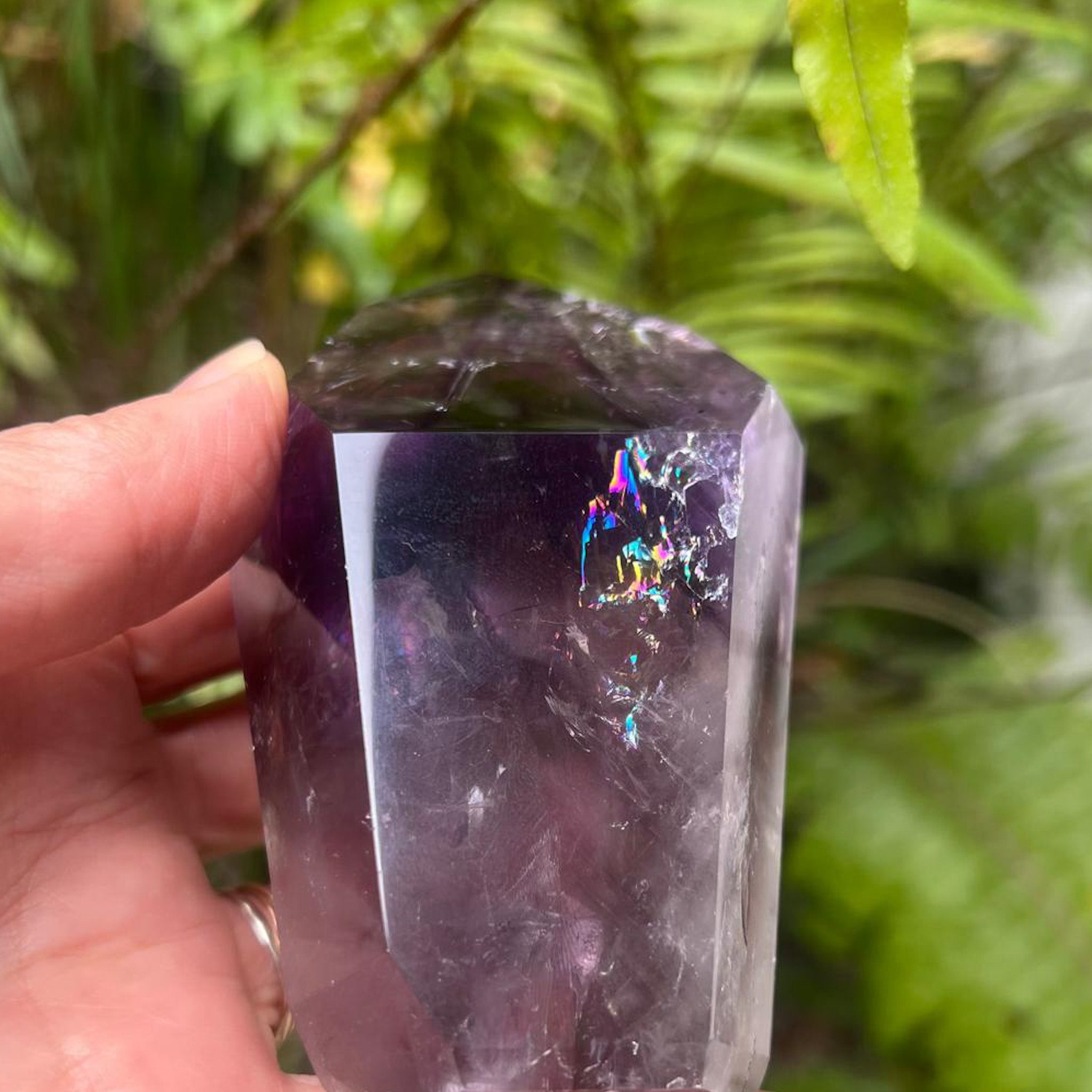 Purple Phantom Amethyst point with rainbow inclusions