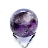 Polished Amethyst crystal ball showing internal inclusions