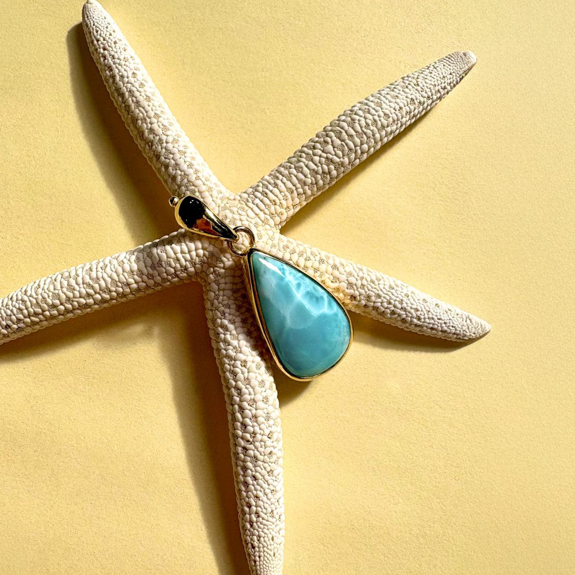 Larimar pendant displayed with starfish styling