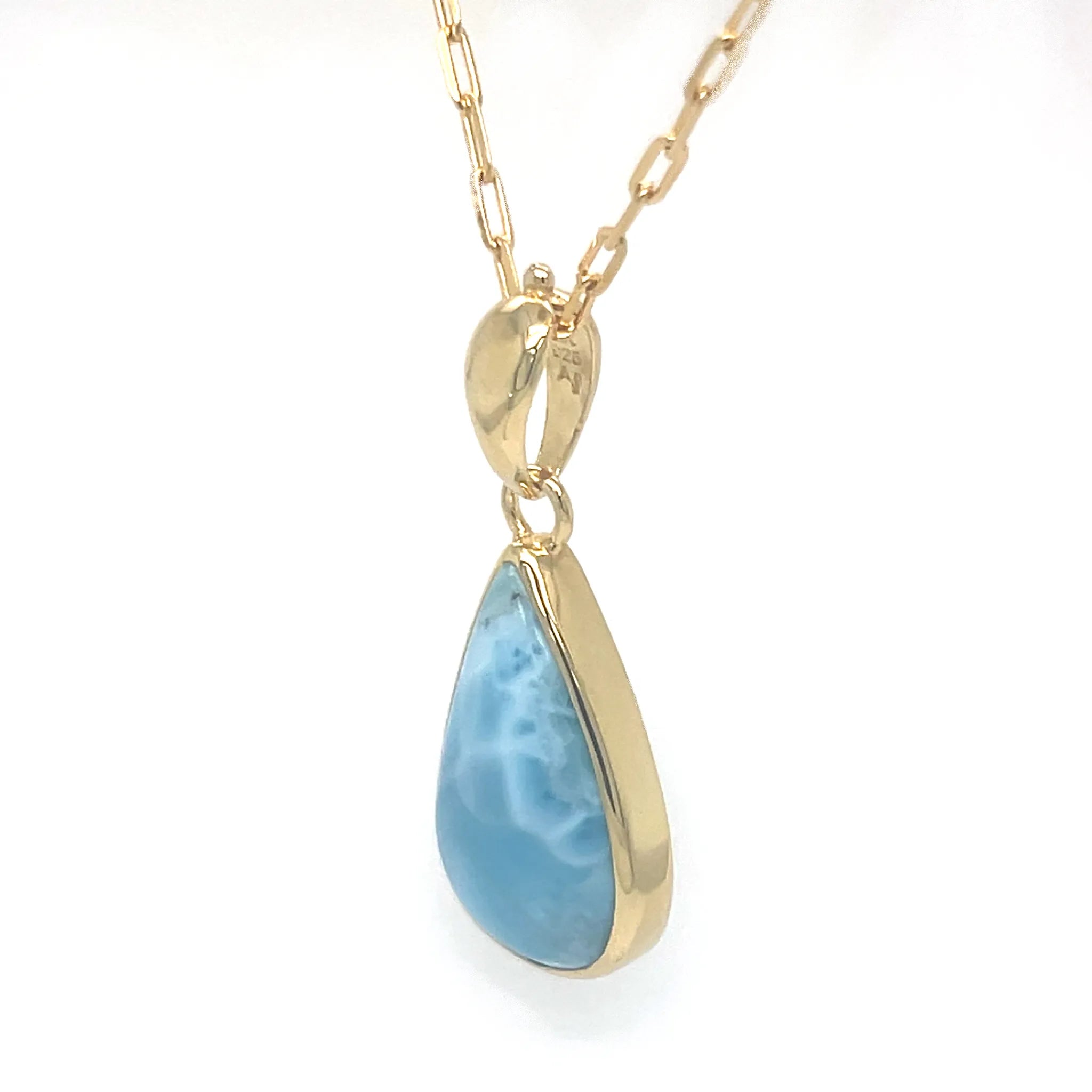     Side view of Larimar teardrop pendant in gold plated setting