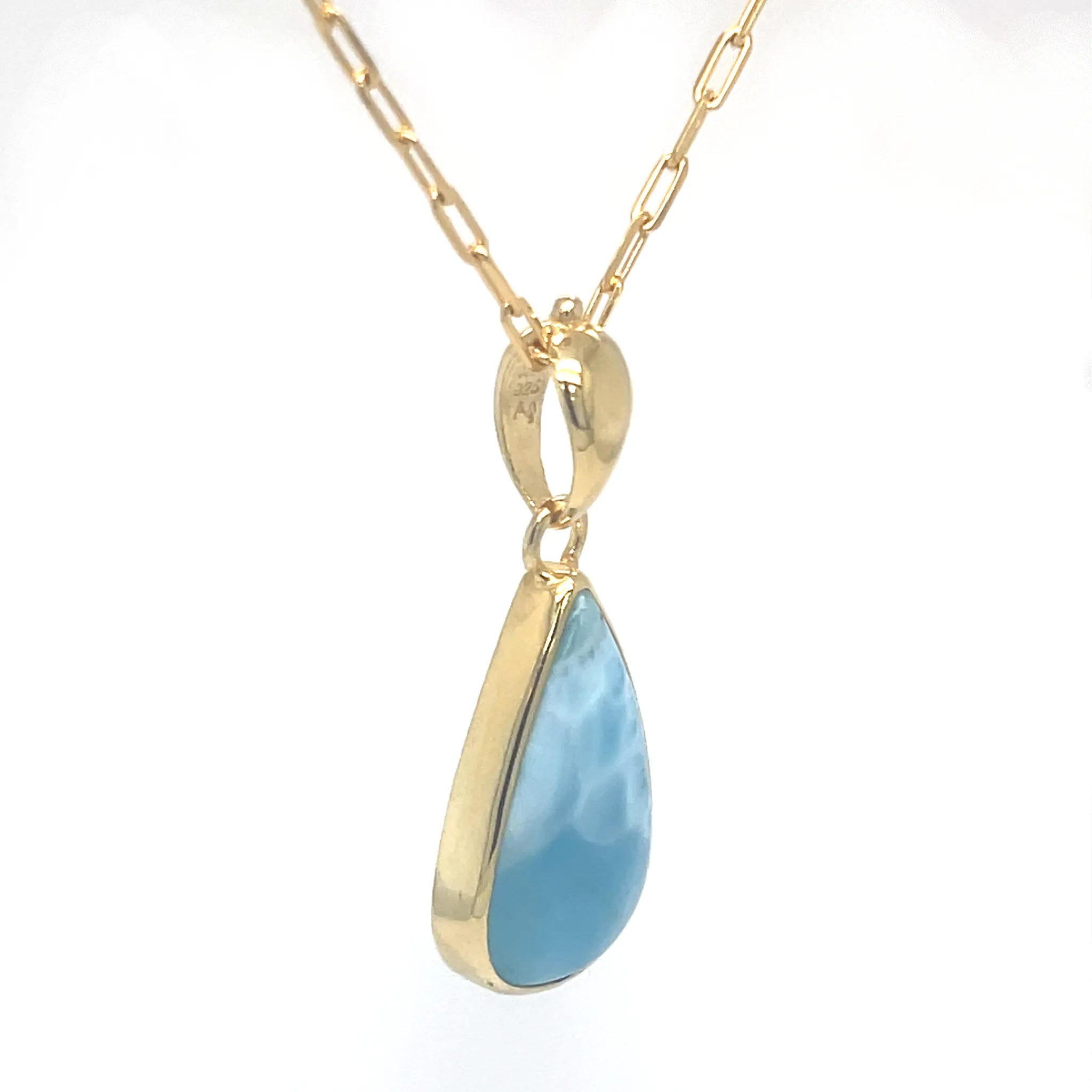 Natural Larimar pendant showing ocean-blue marbling