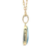Profile view of Larimar gold plated pendant