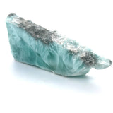 Genuine Larimar slice specimen showing natural matrix edge and blue colour