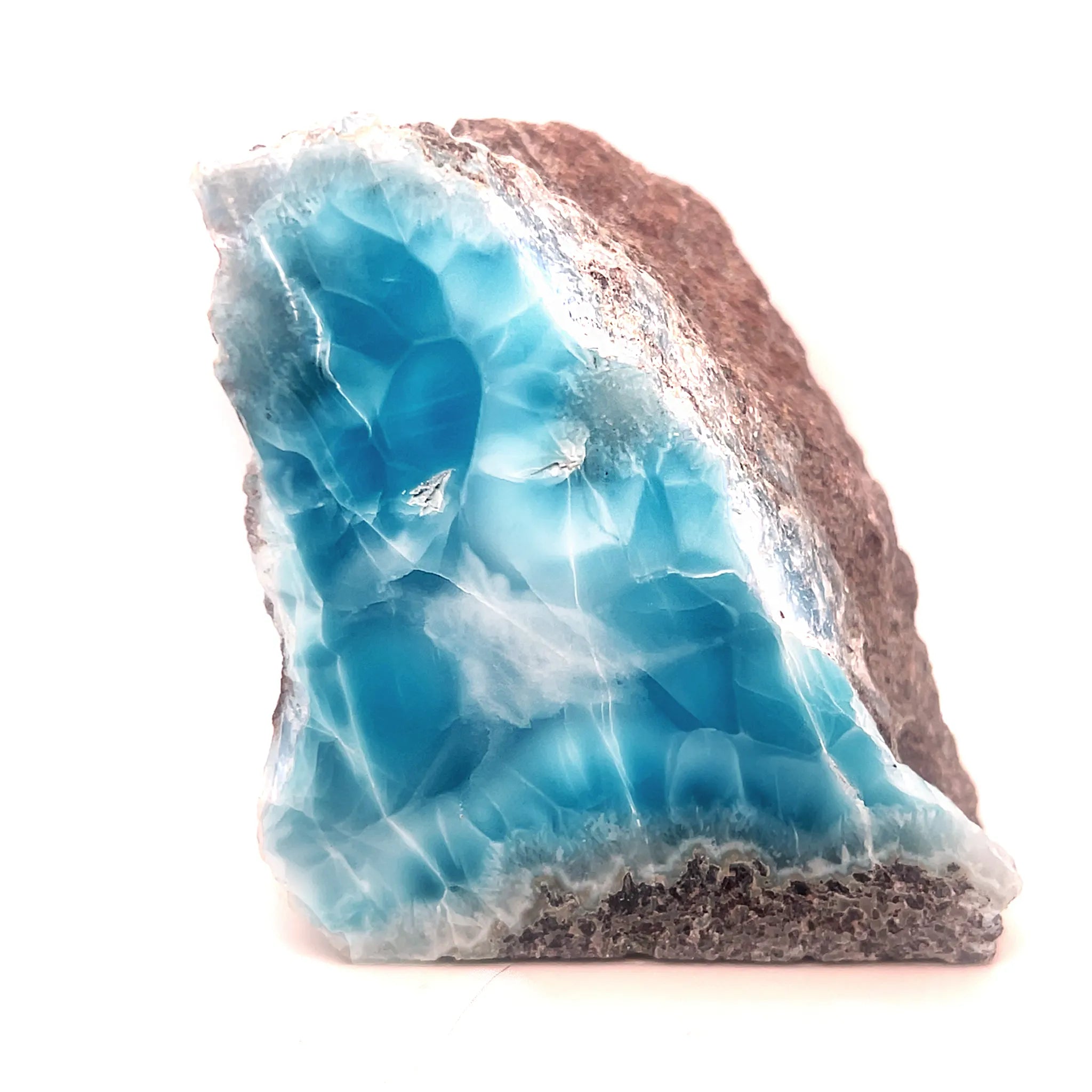 Statement Larimar specimen styled with shell showing ocean-blue polished face