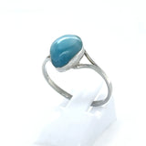 Natural Larimar teardrop ring showing blue cabochon and silver setting