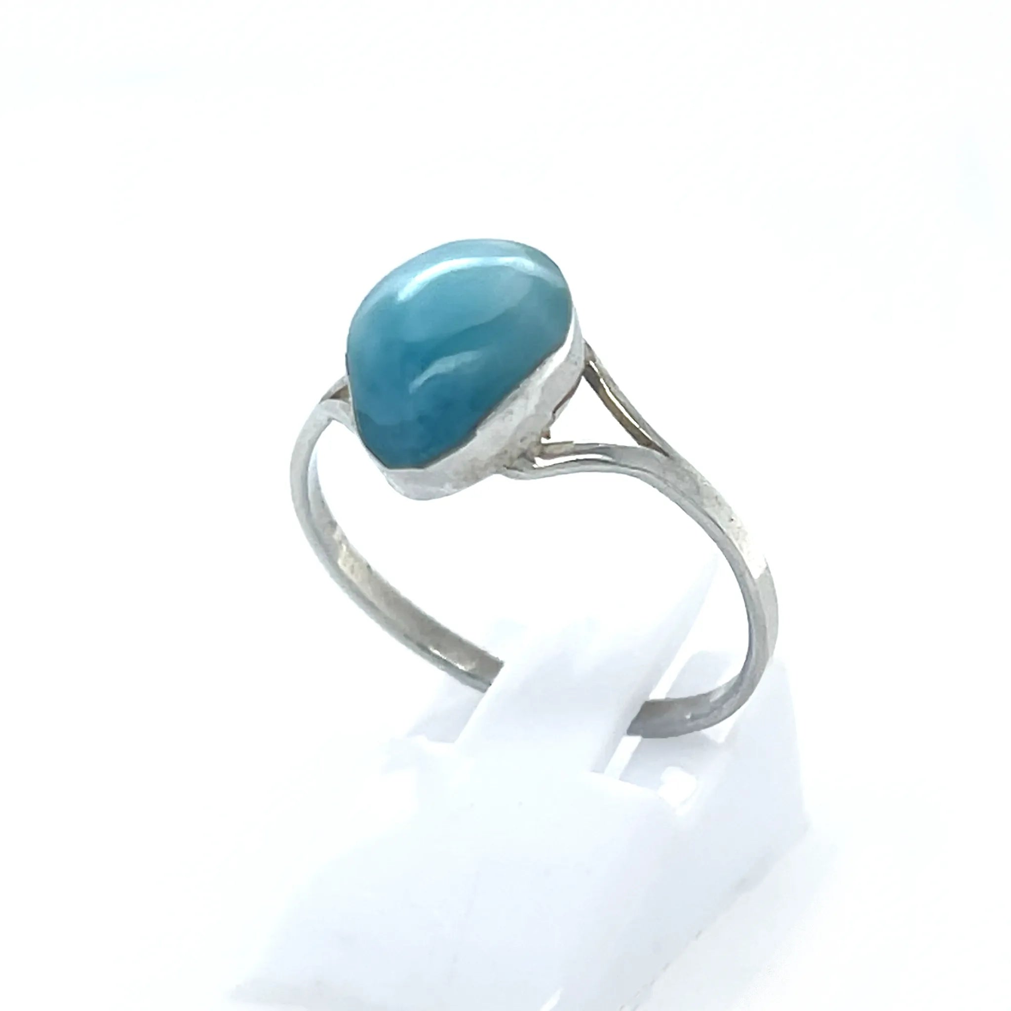 Natural Larimar teardrop ring showing blue cabochon and silver setting