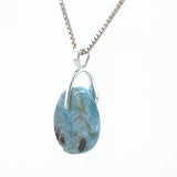 Natural Larimar pendant showing blue colour and white marbling