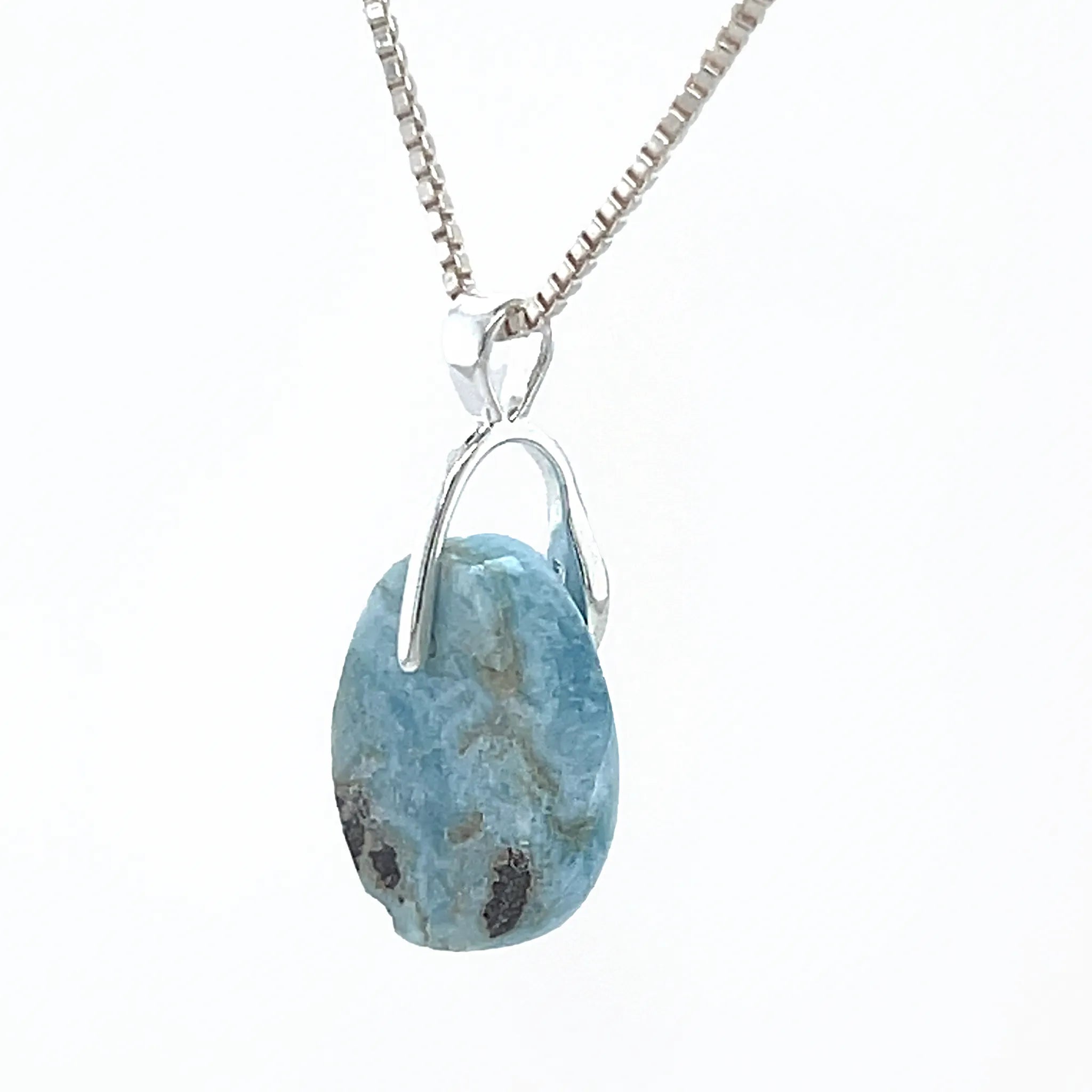 Natural Larimar pendant showing blue colour and white marbling