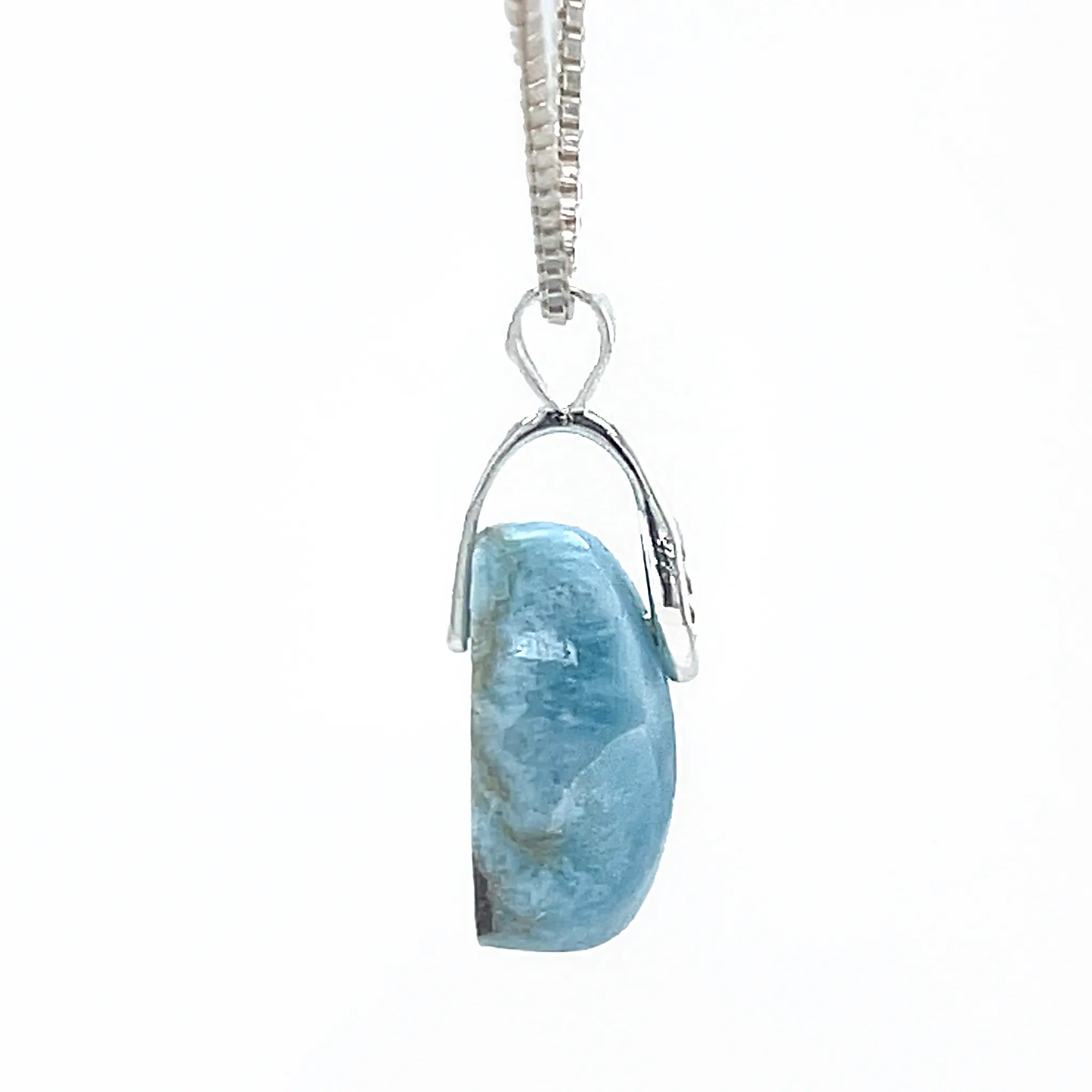    Side view of Dominican Republic Larimar pendant in silver setting