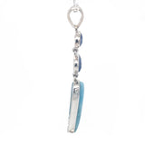 Side view of Larimar cabochon and faceted Blue Kyanite gemstones in sterling silver