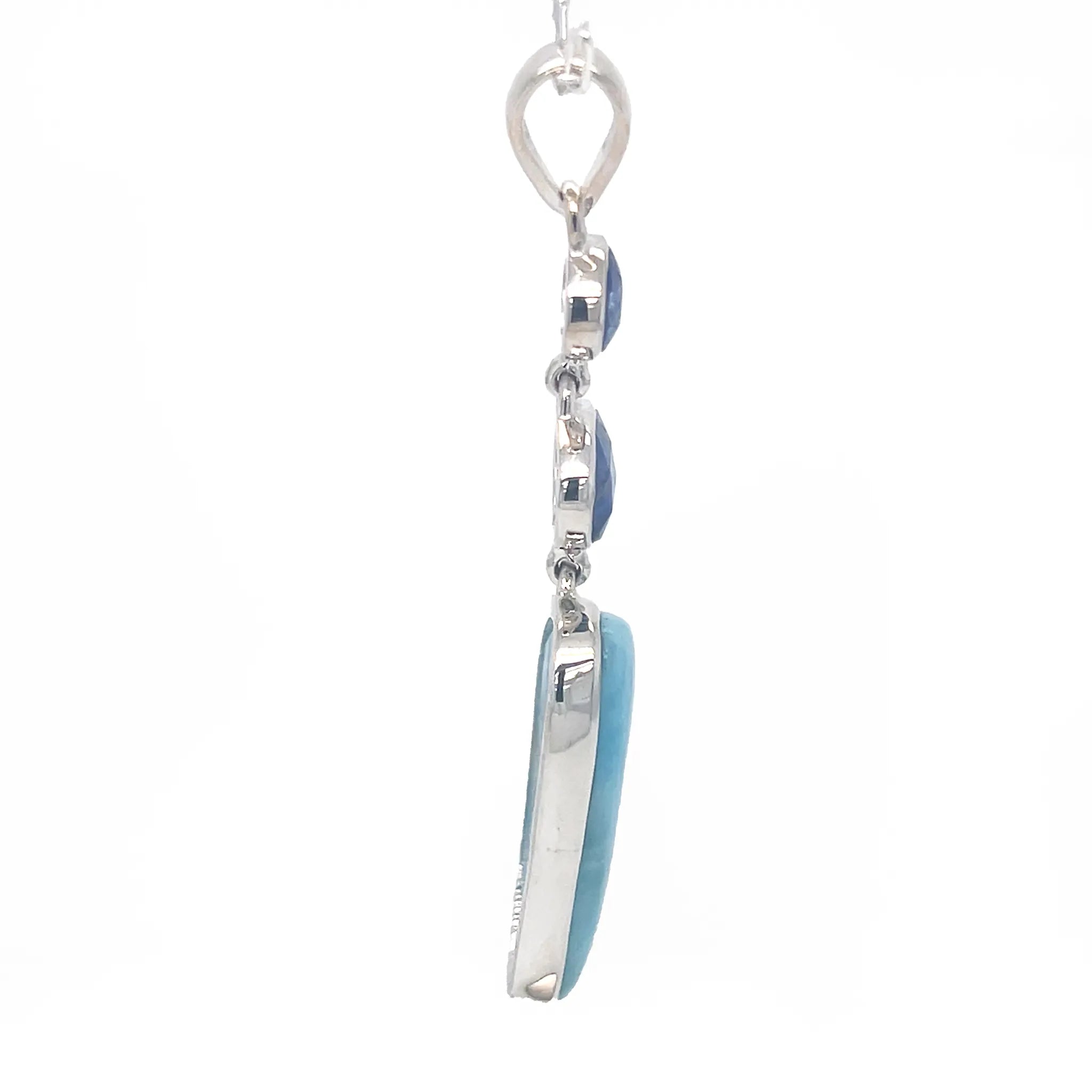 Side view of Larimar cabochon and faceted Blue Kyanite gemstones in sterling silver