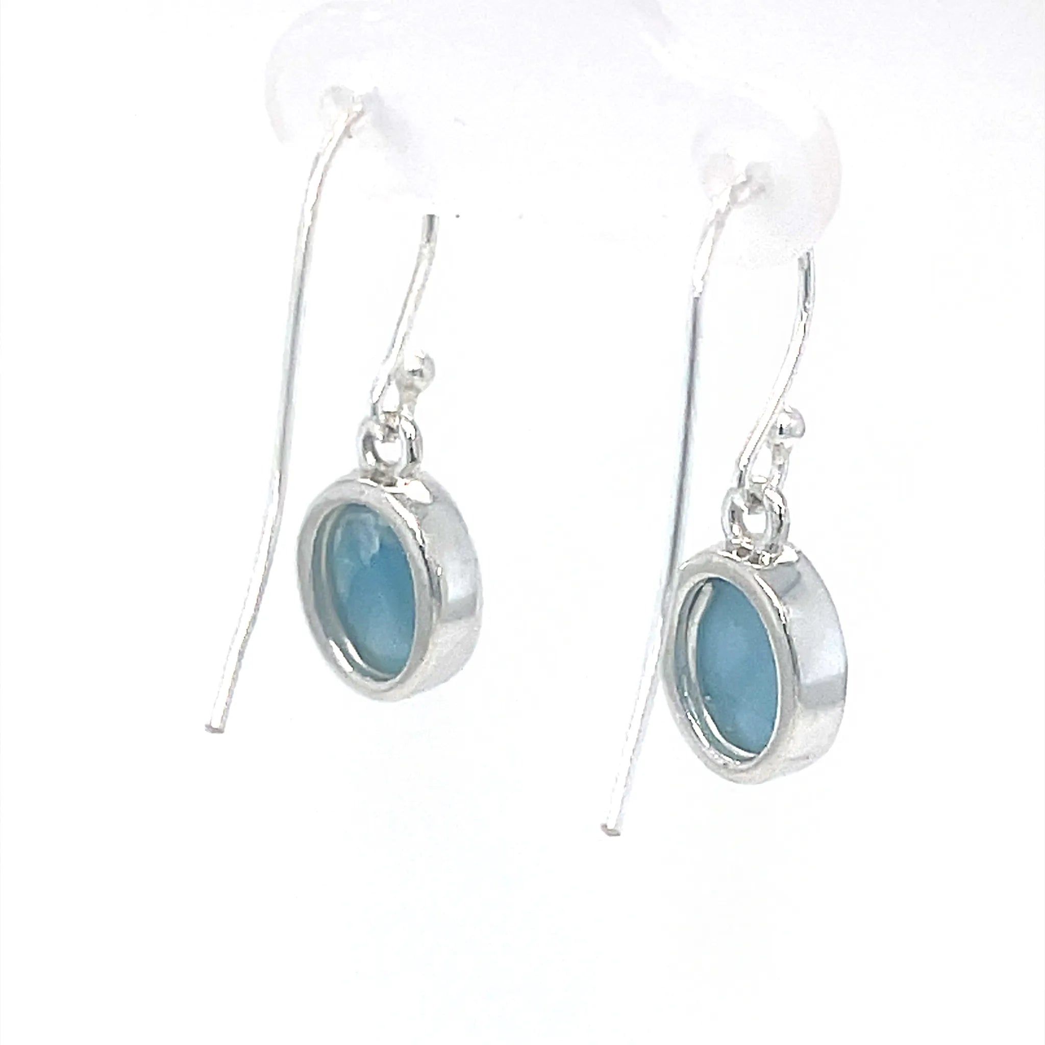 Natural Larimar oval earrings showing Caribbean-blue colour and white marbling