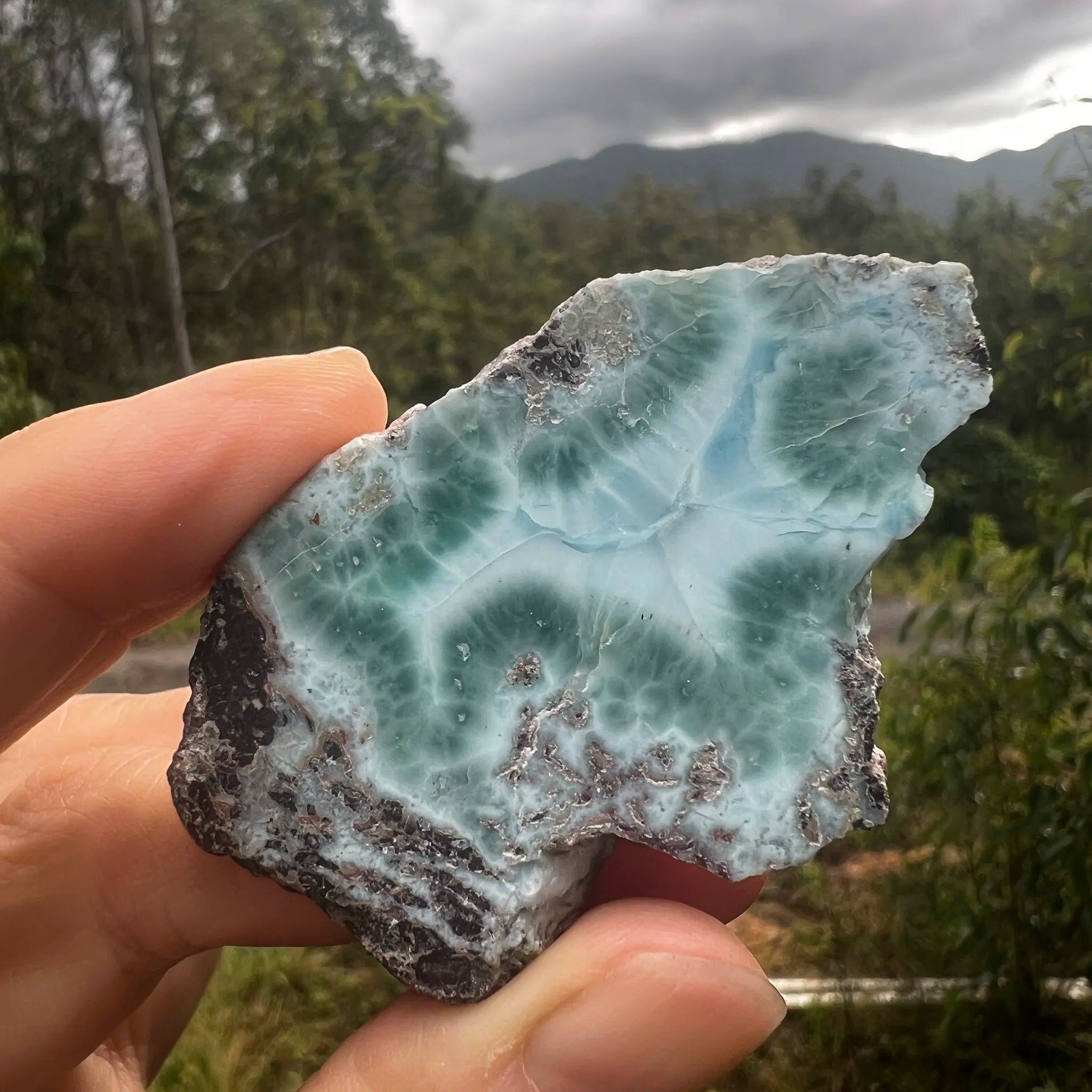 Genuine Larimar specimen from the Dominican Republic held in natural light