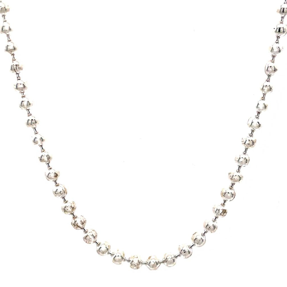 Silver necklace with small beads on a white background