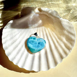 Larimar silver heart pendant styled on shell with Caribbean-blue stone