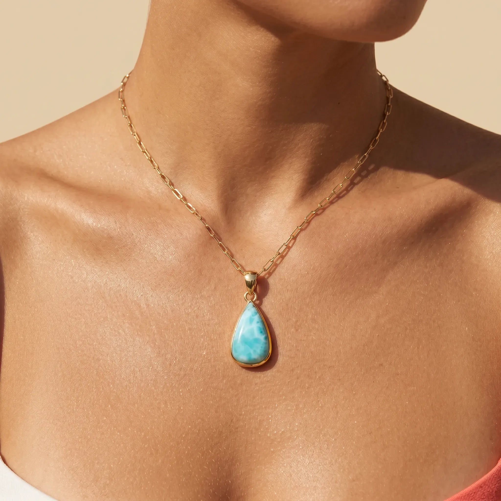 Larimar teardrop pendant worn on model