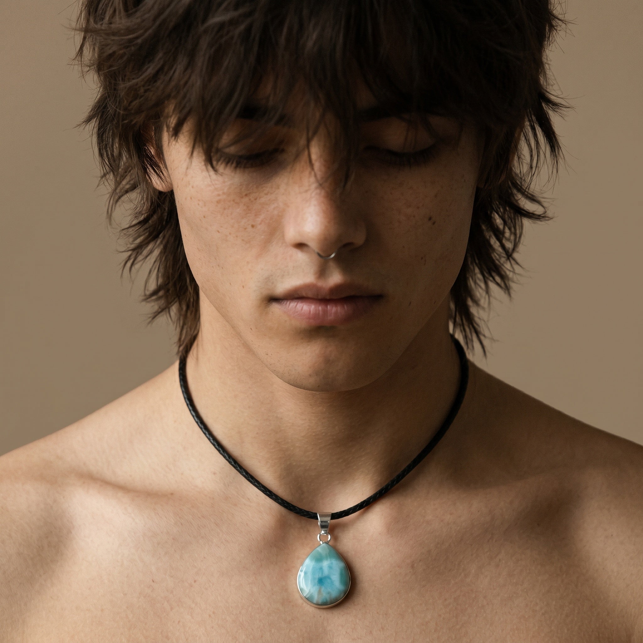 Larimar teardrop necklace worn on model with black cord for scale and styling